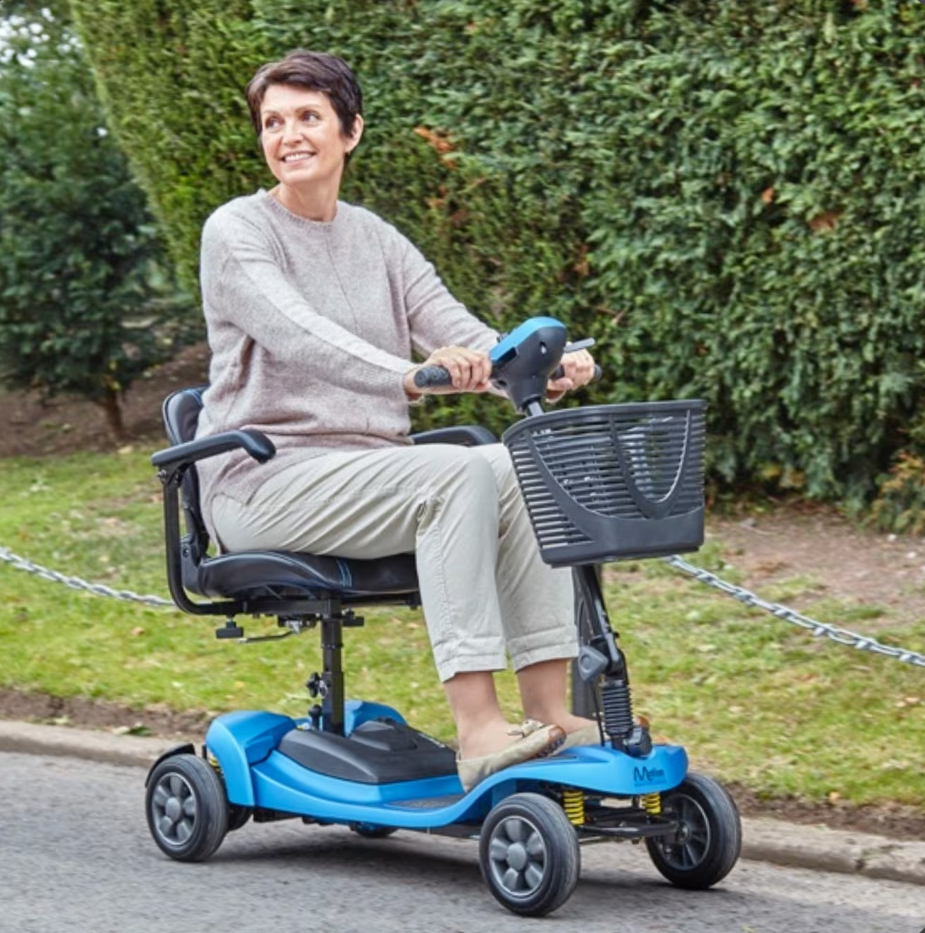 Woman riding the motion healthcare lithilite pro best boot scooter