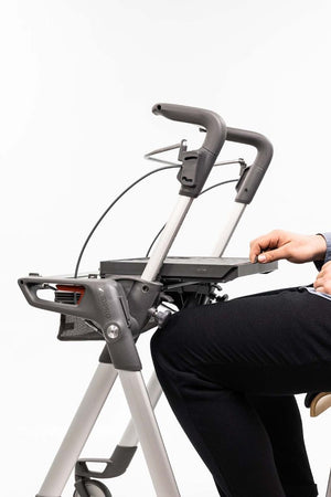 man sitting down at the ToPro Hestia Rollator