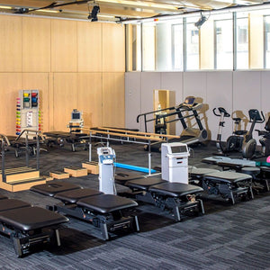 Stabil Pro 3-Section Treatment Table Black in a PT clinic