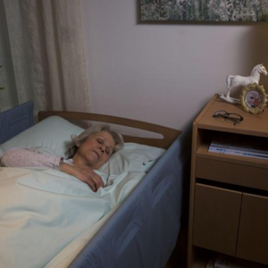 Invacare | Soft Tilt Automated and Manual Patient Repositioning for Enhanced Comfort and Care woman using and sleeping