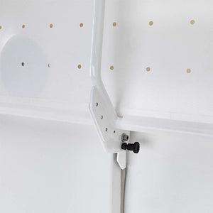 Prism Medical | Freeway Manual Height Adjustable Shower Stretcher folded against wall