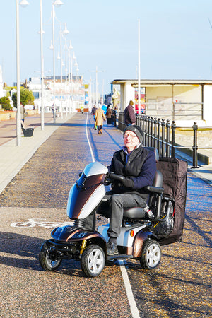 Scooterpac Universal Foldaway mobility scooter Canopy. automated Rain protection attached to the back of a mobility scooter