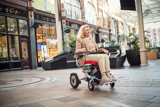 Motion Healthcare Aerolite Trekker Electric Wheelchair in use 