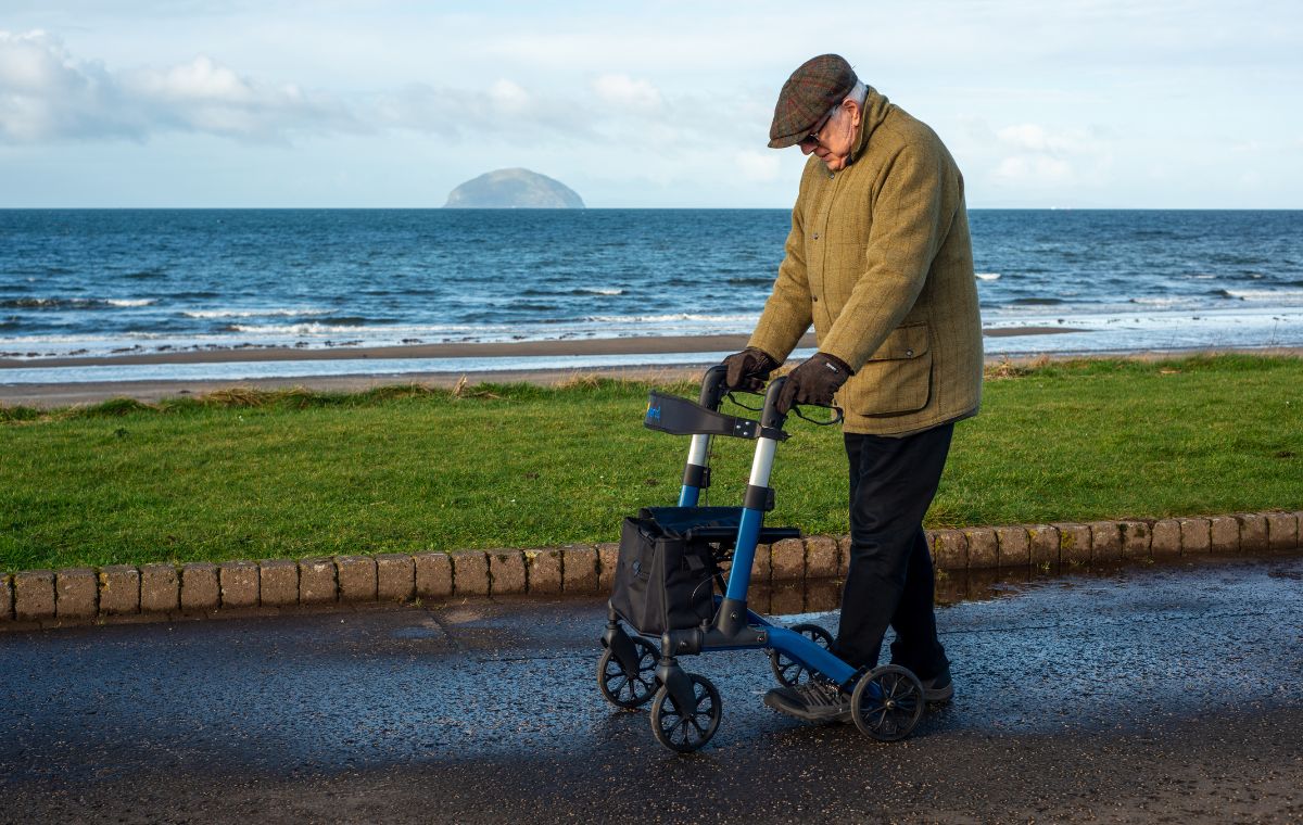 Alerta Four Wheel Aluminium Foldable Rollator in use