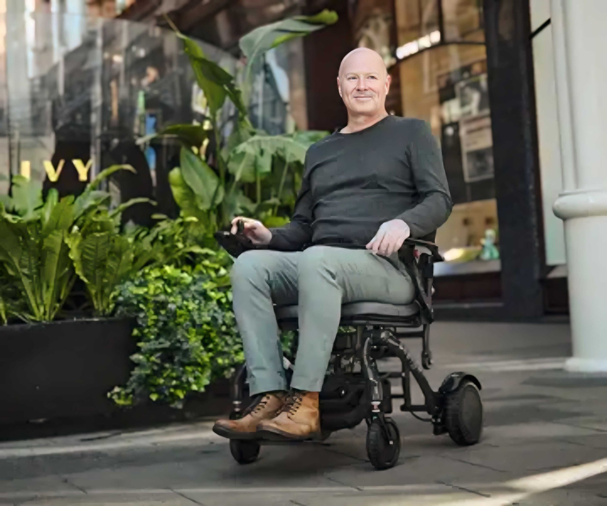 Motion Healthcare Photon Electric Wheelchair in use