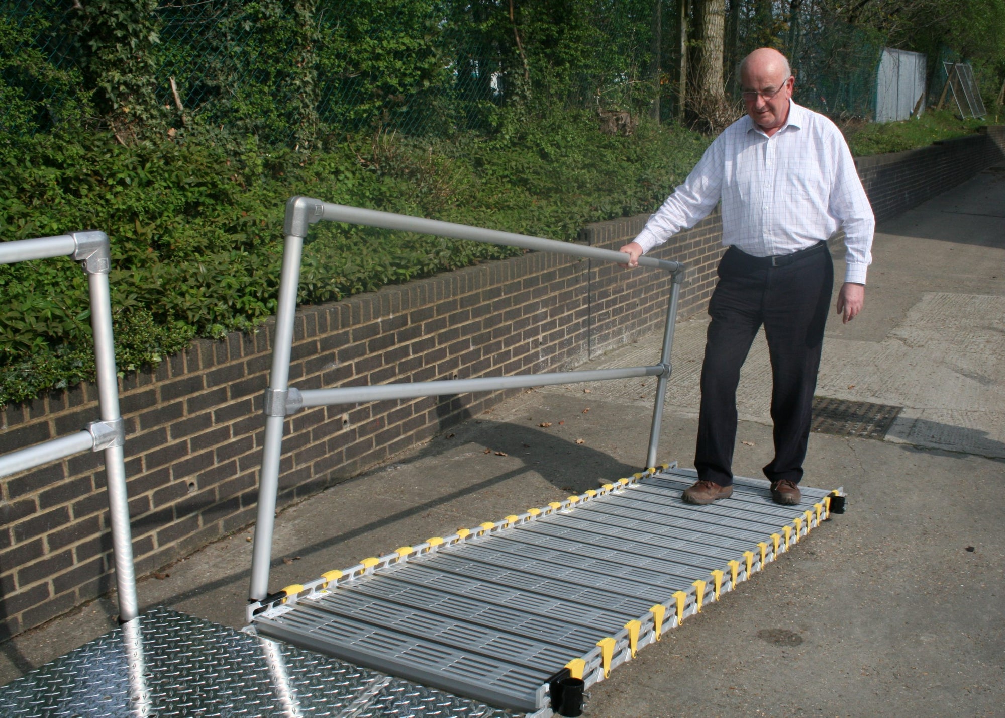 roll-a-ramp folding wheelchair ramp with handrail