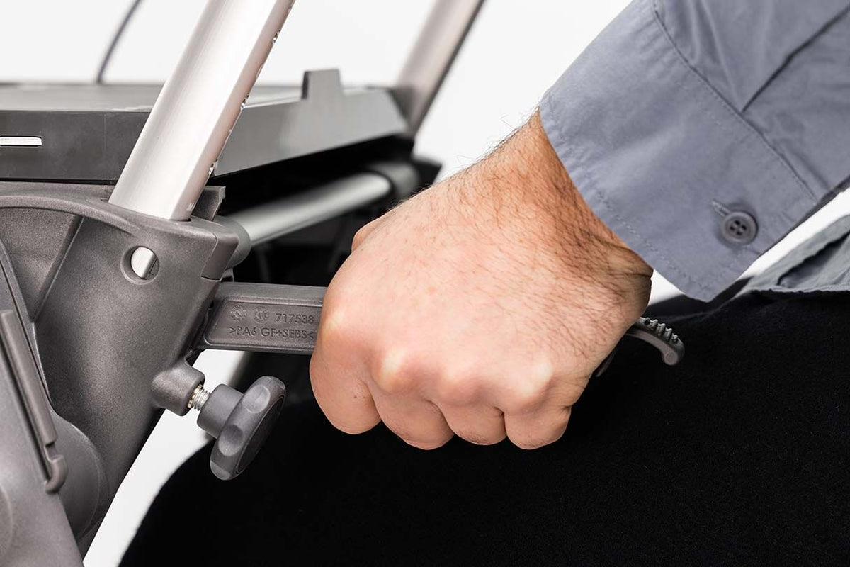 man using the ToPro Hestia Rollator lower grap handles