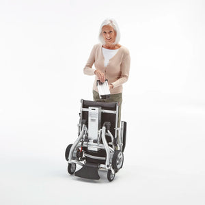 Woman with Motion Healthcare Aerolite Power chair, Lightweight, Electric Folding Wheelchair, Lithium Battery
