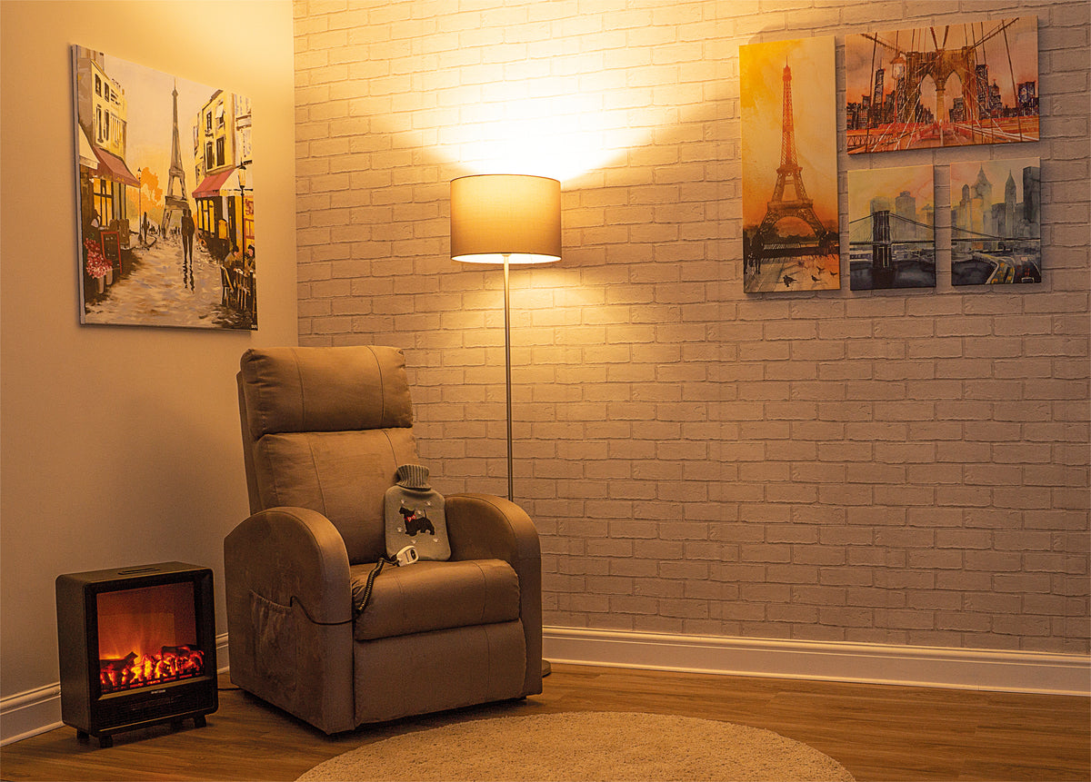 Dove grey Aidapt Daresbury Rise and Recline Chair | Electric Recliner Chair for the Elderly and Disabled in room setting in the evening