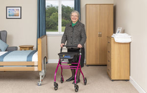 Alerta Four-Wheel Aluminium Lightweight Indoor Rollator in use