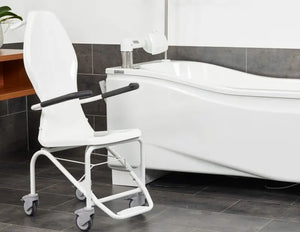 Astor Bannerman Compact DCII Bath seat attached to the transfer trolley