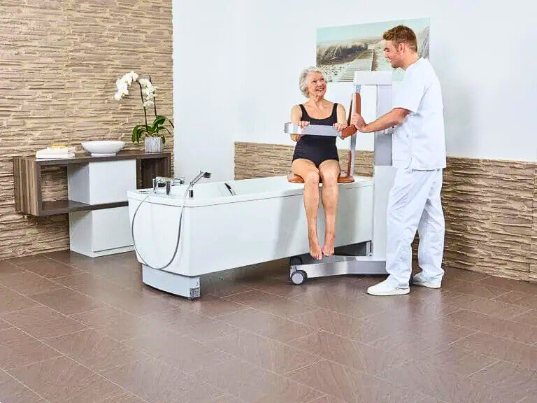 Astor Bannerman Eve Multi-Functional Shower and Bath Lift in use by patient