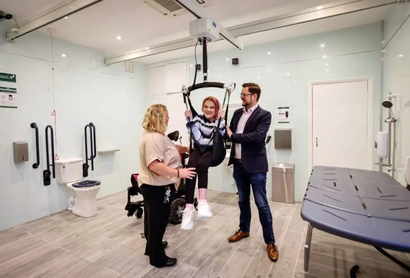 Astor Bannerman OT200 Ceiling Track Hoist in use by a patient