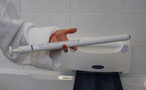 Bath Knight Bath Lift User Holding Battery