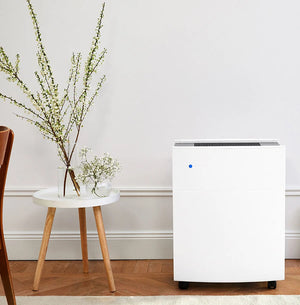 Blueair Classic 680i Air Purifier beside a side table