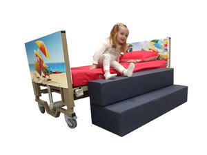 Centrobed Carribean Paediatric Turning Profiling Bed in use with a girl going down the steps