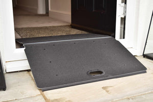 Enable Access Doorline Butterfly Wheelchair Ramp Folded and on doorway high threshold