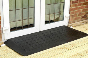 Enable Access Doorline-Neatedge Rubber Doorway Wheelchair Ramp in front of a two door hous