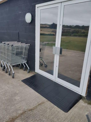 Enable Access Doorline-Neatedge Rubber Doorway Wheelchair Ramp long infront of a two door