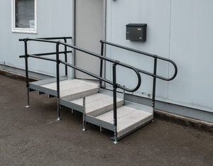 Enable Access Welcome Landing Steps with Stand Alone Steps Standard and Wide connected to a shipping container office