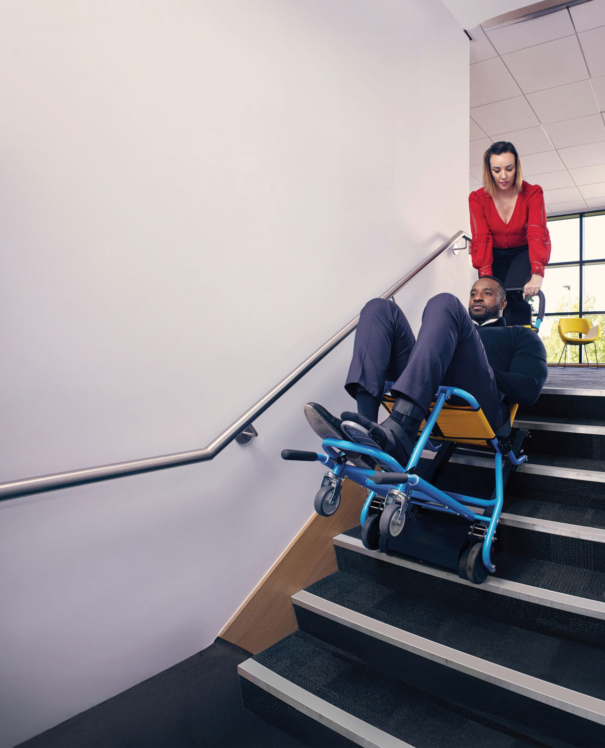 Evac + Chair 1000H Powered Evacuation Chair in use going down the stairs