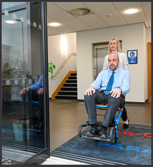 patient pushed out of building with Evac+Chair 200H Evacuation Chair For Horizontal Evacuation 