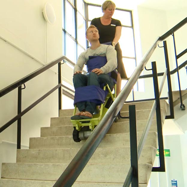 Evaccess Power Trac SC-6 Evacuation Chair in use going down the stairs