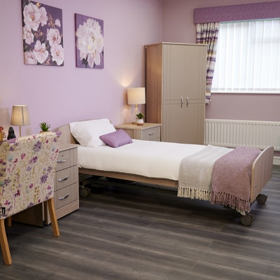 Harvest Healthcare Cadence Premium Profiling Bed in a room