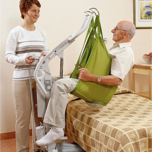 Hillrom Sabina II EE Mobile Lift in use to lift patient off the bed