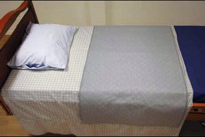 Direct Healthcare Group Incosheet incontinence sheet laid on top of bed