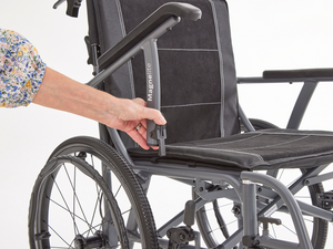 Unclipping arm rest on the Motion Healthcare Magnelite transit and self propelled,, Lightweight, Folding Wheelchair, Manual and Self Propelled