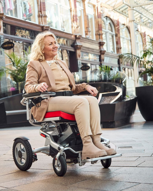 Motion Healthcare Aerolite Trekker Electric Wheelchair in use