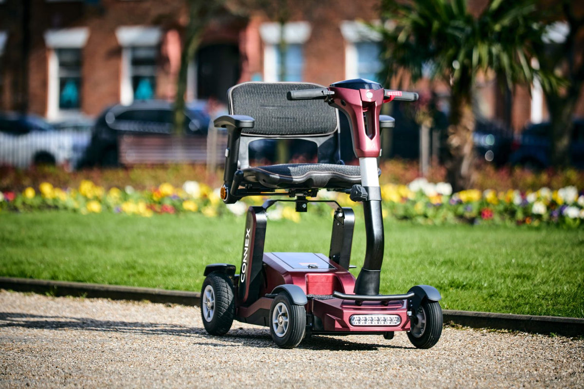 Motion Healthcare Connex Automatic Folding Mobility Scooter in colour burgundy outside