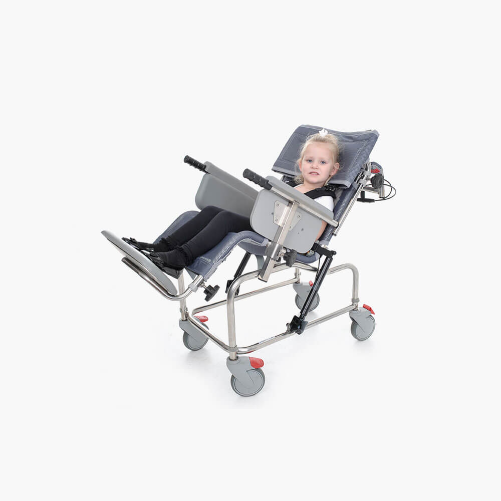 Child using the Osprey 900 Tilt in Space Infant Paediatric Shower Cradle tilted