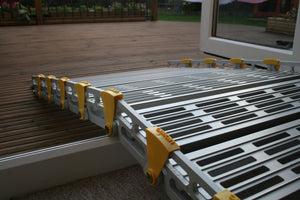 Roll-a-ramp portable and foldable disabled wheelchair ramp over door threshold