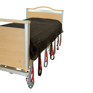 Direct Healthcare Group SafeHandlingSheet laid Horizontal Sling and Transfer Aid on top of hospital bed