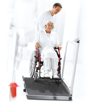 Seca 665 Wheelchair Scale in use by a patient on a wheelchair