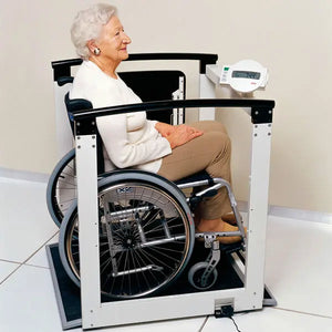 Seca 685 EMR Multifunctional Scale in use by elderly patient on a wheelchair