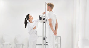 Seca 711 Mechanical Column Scales with Eye Level Beam in use by patient