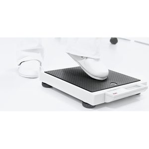 Seca 875 Digital Flat Scale patient about to step on the scale