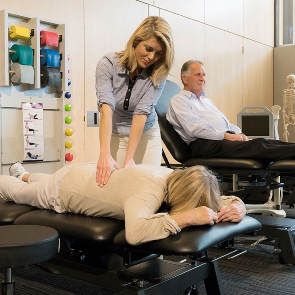 Stabil Pro 2-Section Treatment Table- Black in use with patient facing down