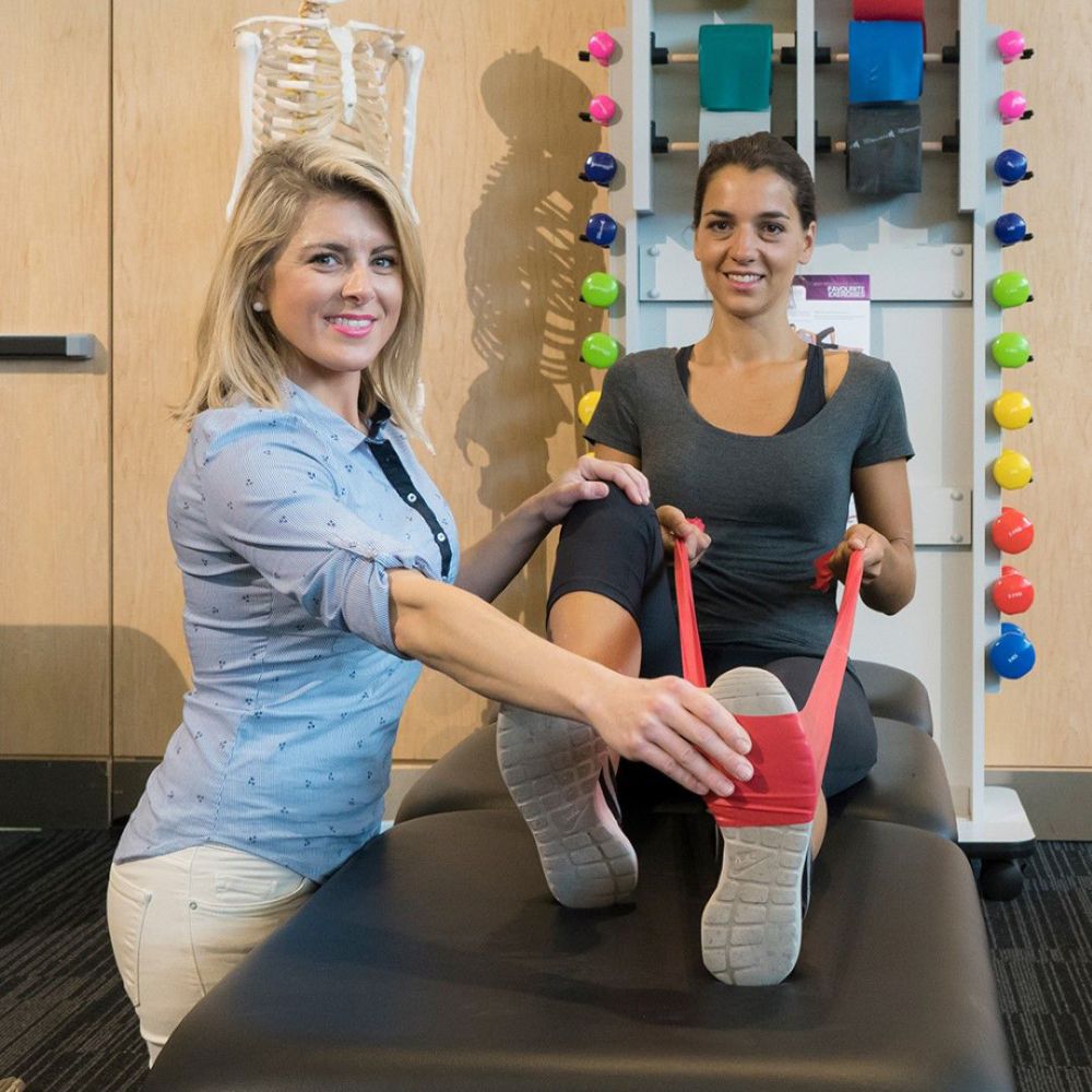 Stabil Pro 2-Section Treatment Table- Black in use with patient sitting