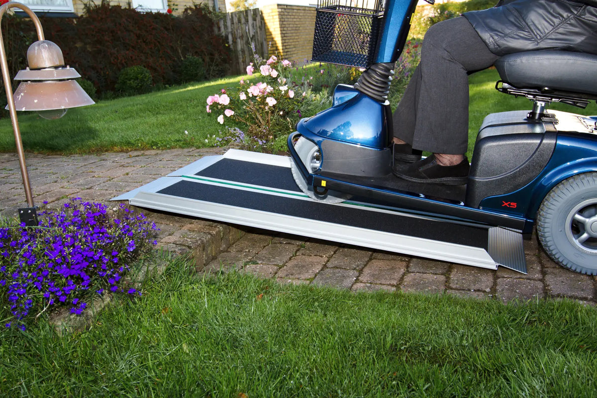 Stepless Guldman EasyFold Pro Ramps being used by a mobility scooter close up