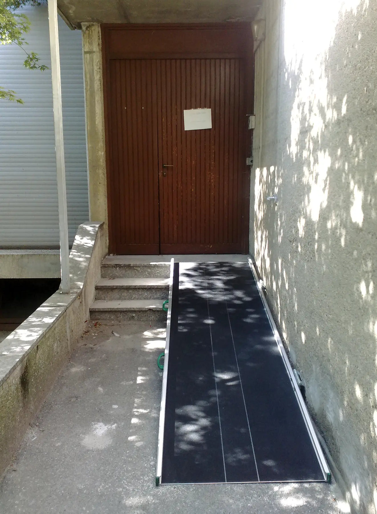 Stepless Guldman Wide Folding Ramps lifestyle photo placed on the steps