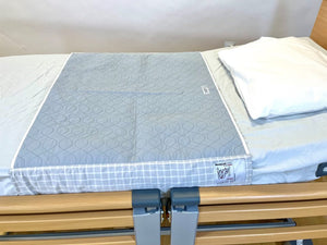 Direct Healthcare Group WendyLett4Way Sliding DrawSheet Laid Flatly on Bed with a Pillow