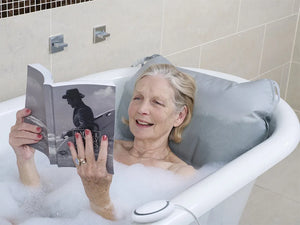 Winncare Mangar Inflatable Bathing Cushion With Airflo 12 as user reads a book