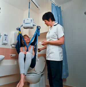 Wispa ceiling hoist in use in a bathroom