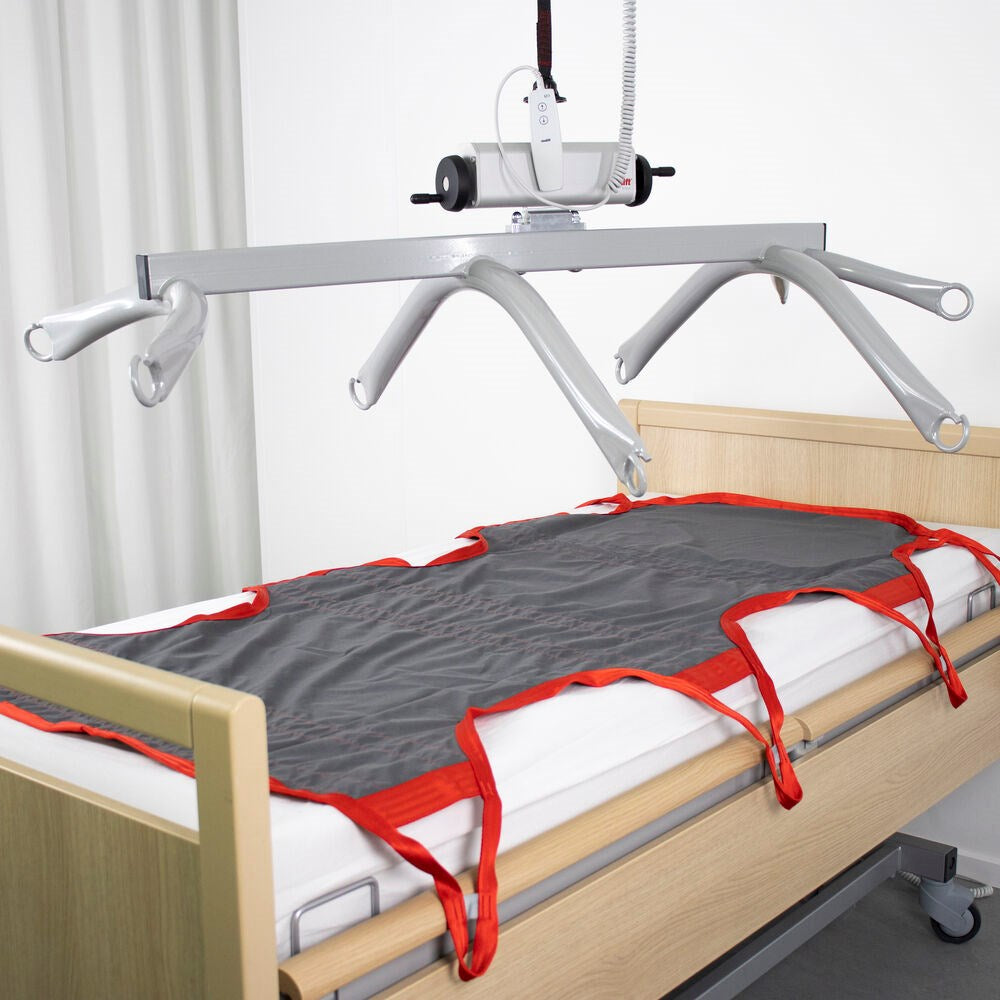Etac Molift Partner 255 8 point hoist bar being used with the 8 point patient sling