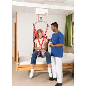 lifting a patient with the Etac | Molift Air 200 Track Hoist For Ceiling Tracks and Gantry Systems