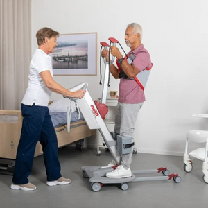 Etac | Elevate Mobility and Comfort with Molift RgoSling StandUp The Ideal Padded Sling for Active Hoisting and Versatile Seating lady helping patient